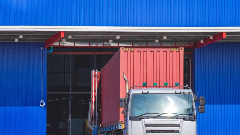 trailer-truck-is-unloading-construction-equipment-2023-11-27-05-23-00-utc